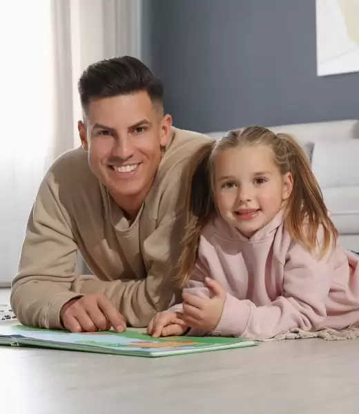 Dad and daughter lying in the floor Low Res